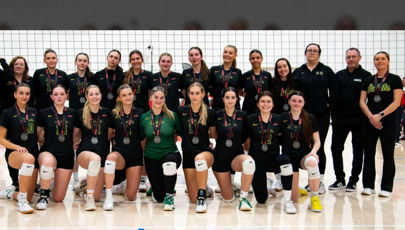 Saints Women's Volleyball team sporting OCAA silver medals