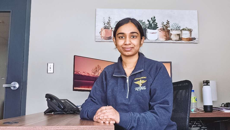 Arya Krishna sitting at her desk at the County of Renfrew