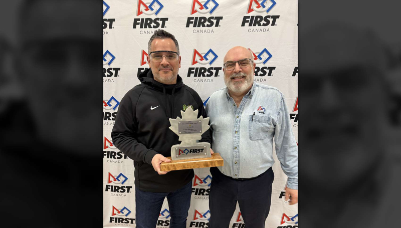 St. Clair College President Michael Silvaggi holding the FIRST Robotics Canada Education Partner Excellence Award with Larry Koscielski of Windsor-Essex FIRST Robotics 