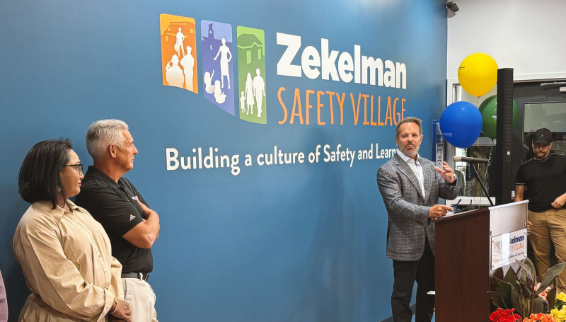 Barry Zekelman of the Stephanie and Barry Zekelman Foundation speaks to a crowd at the newly renamed Zekelman Safety Village during a launch party
