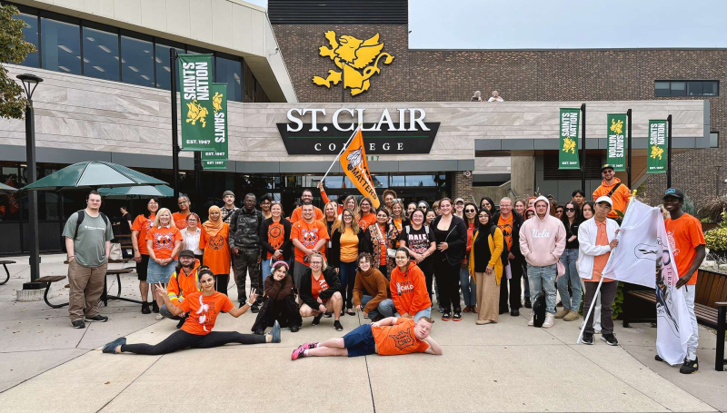 Students, faculty and staff pose at St. Clair College's Windsor Main Campus