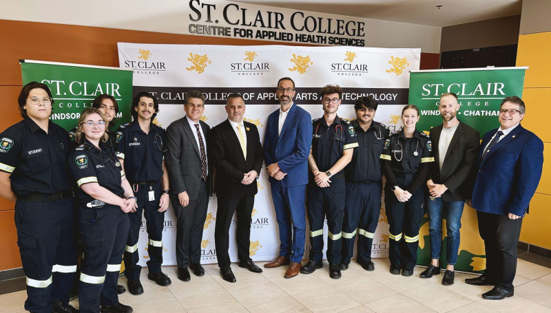 MCURES Minister Nolan Quinn, St. Clair College President Michael Silvaggi and Windsor-Tecumseh MPP Andrew Dowie are flanked by faculty and students in the Paramedic program