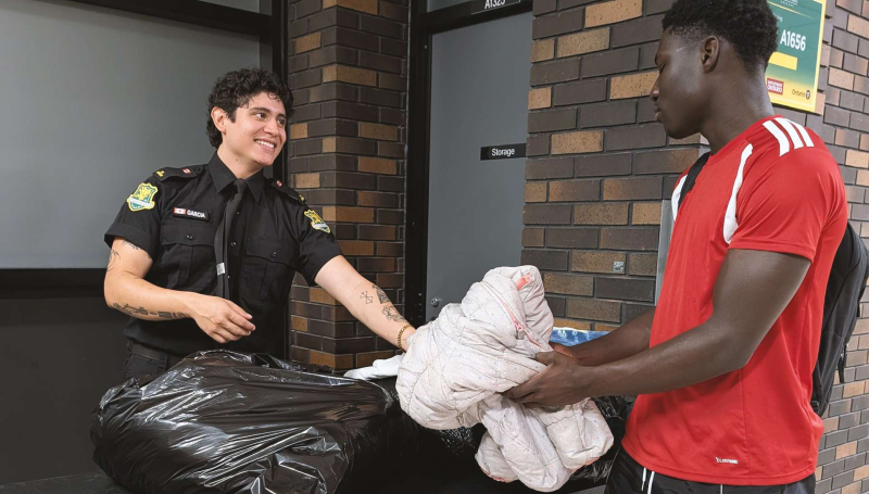 Man handing over clothing