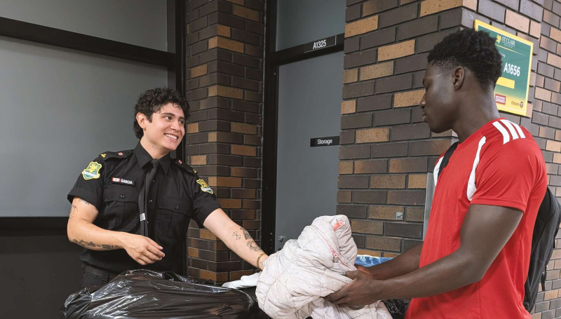 Man handing over clothing