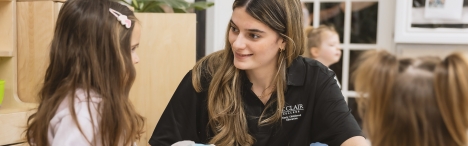 Female student working with young children