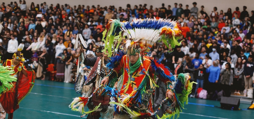 Indigenous member performing a traditional dance