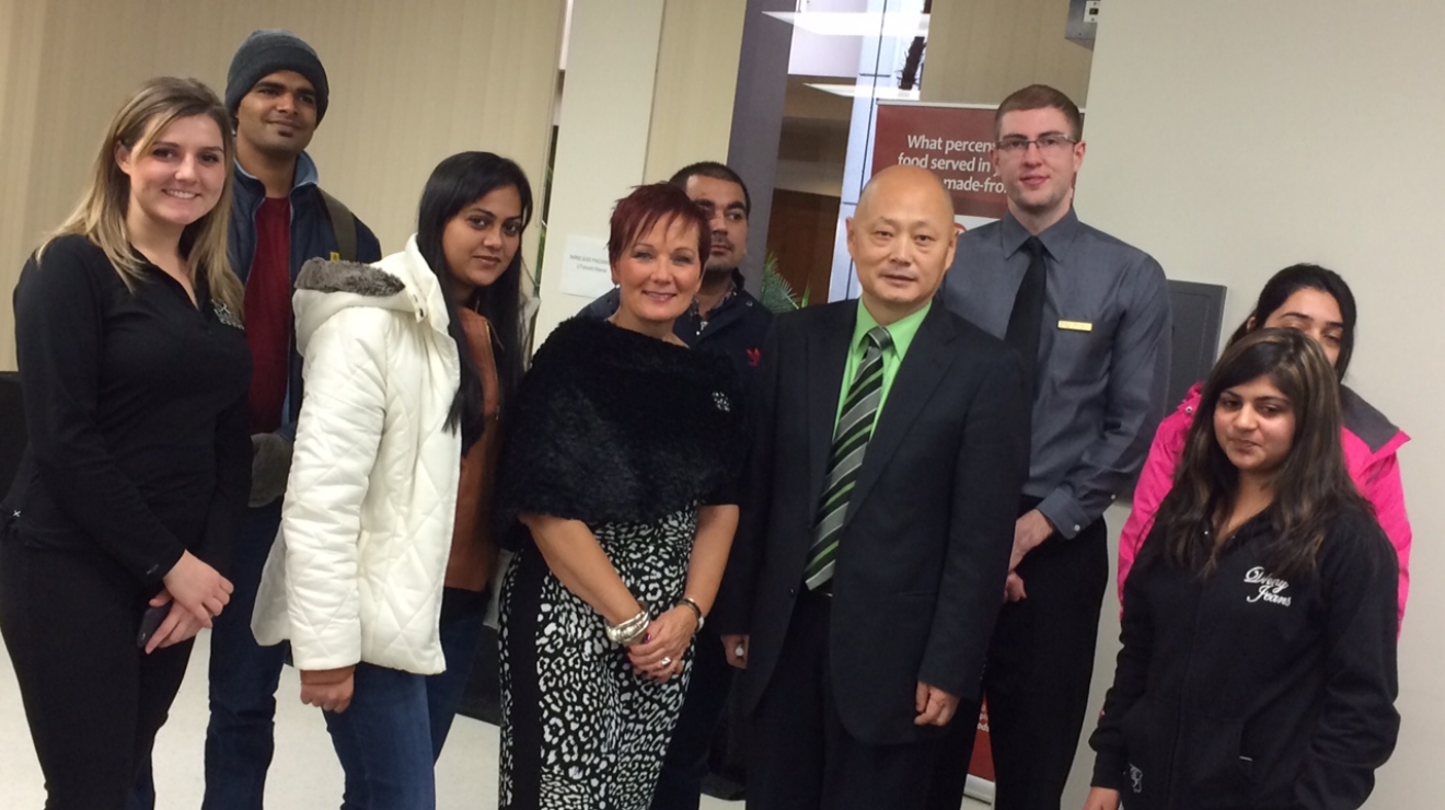 Group of people posing for the camera.