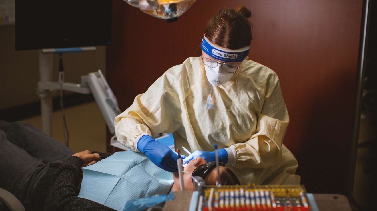 Hygienist working on a patient's teeth